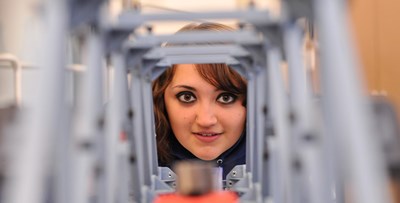 Civil Engineering Female Student Looking through tunnel like structure