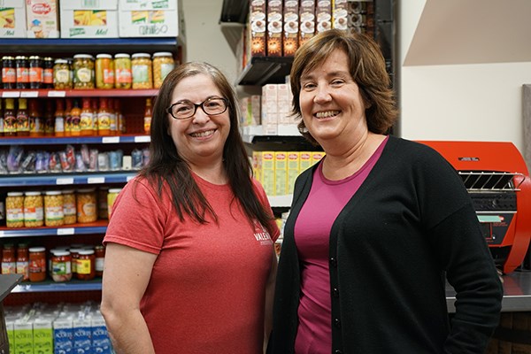 Portuguese journalist Claudia Lobo with Maria Arseneault at Valentina's Portuguese Market in Back Central, Lowell