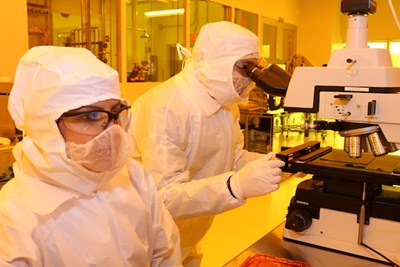 Researchers work in the clean room at Saab ETIC