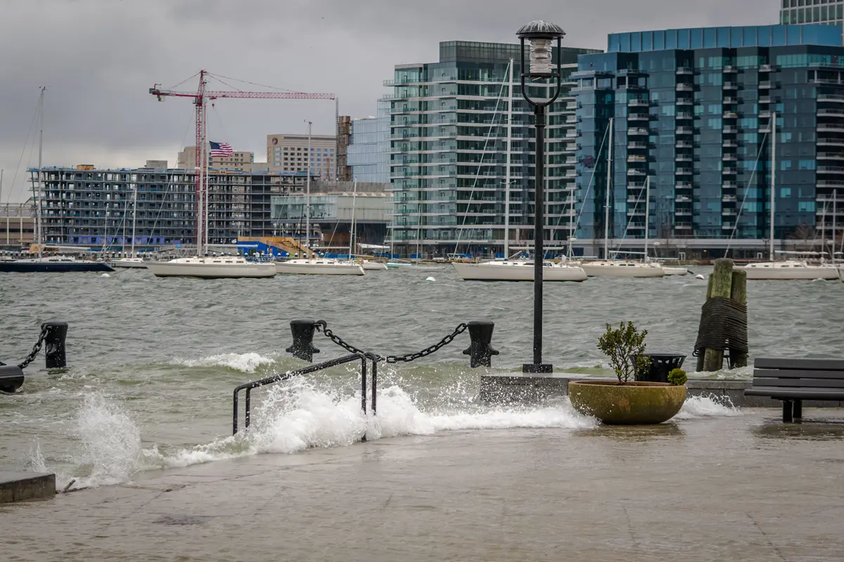 Waves churned up by a storm flood Long Wharf in Boston, Massachusetts