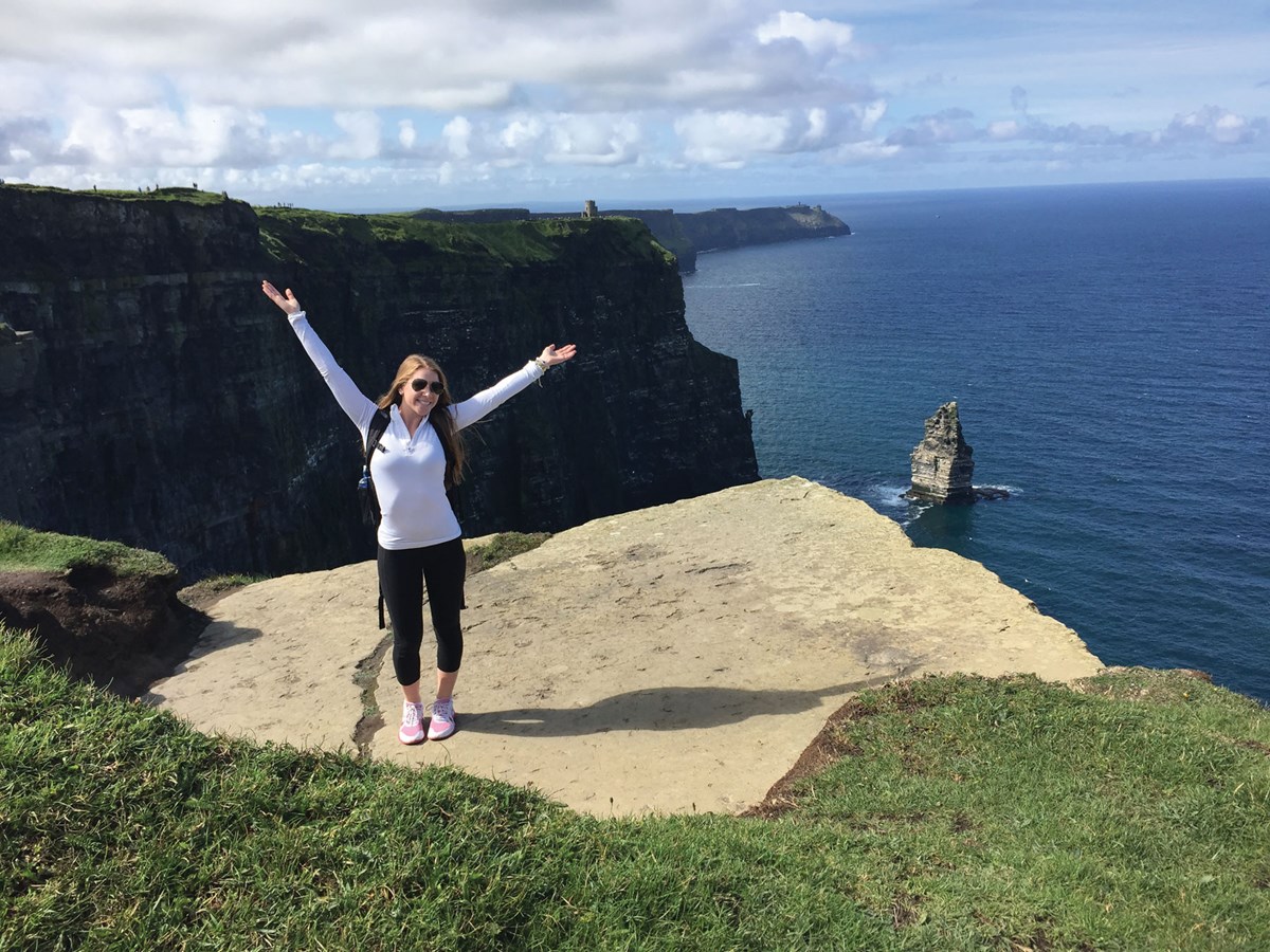 Colleen Franks standing on cliff in Europe