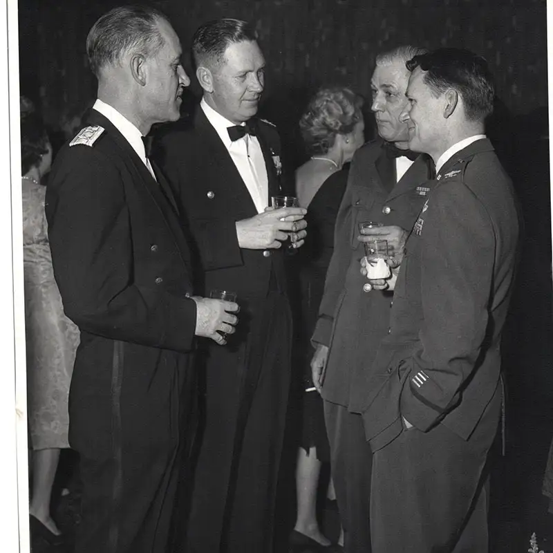 Circa 1953 Air Force Reserve Officers Training Corps members gather at a celebration.