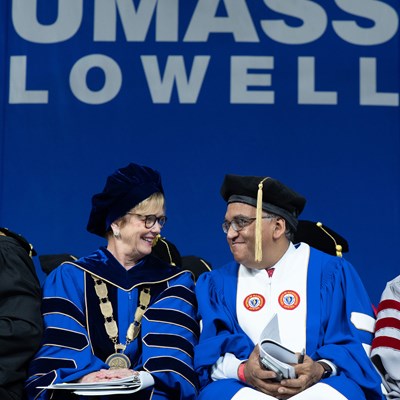 Chancellor Moloney and Dr. Ashish Jha share the Commencement stage at Mass Lowell