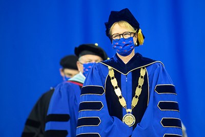 Chancellor Jacquie Moloney processes into the Tsongas Center for Commencement 2021