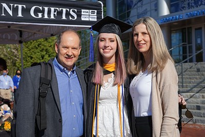 Julia Desrocher '21 with parents Tricia '87 and Rick at Commencement 2021