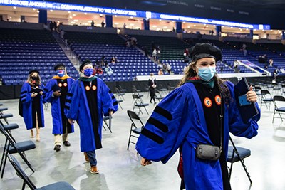 Chancellor Jacquie Moloney processes into the Tsongas Center for Commencement 2021