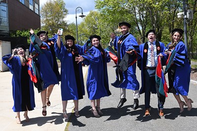 Doctorate recipients jump for joy at Commencement 2021