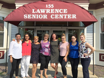 Sabrina Noel, Kelsey Mangano, and Michelly Santos in front of the Lawrence Senior Center
