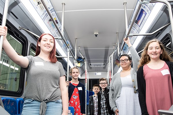 The Cool Science winners for 2019 pose inside a Lowell Transit Authority bus with their artwork