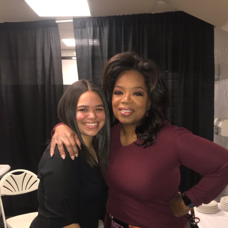 Coral Gonzalez, one of the first UMass Lowell Oprah Winfrey Scholars, poses with Oprah herself