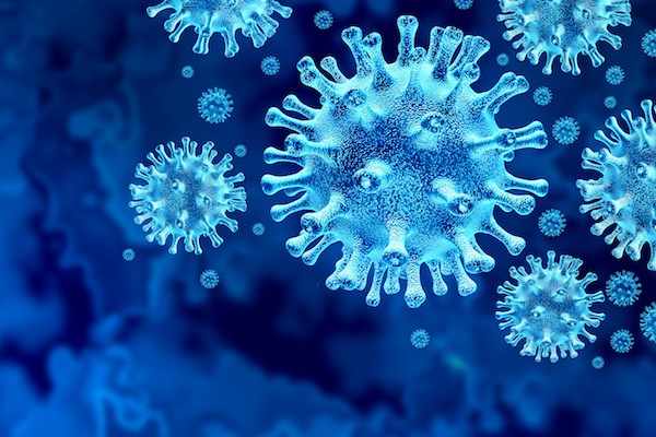 Stock image with blue background and up close view of COVID-19 (coronavirus) molecules.