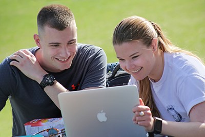 Students work on a laptop on South Campus