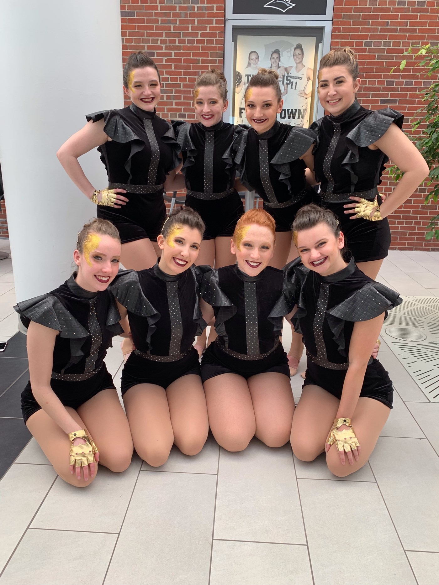 Dance team posing in uniform prior to nationals performance 