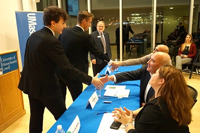 Winners of the DCU Innovation Contest shake hands with judges