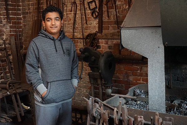 Reynaldo Rivera likes writing in the blacksmith shop at the Lawrence History Center