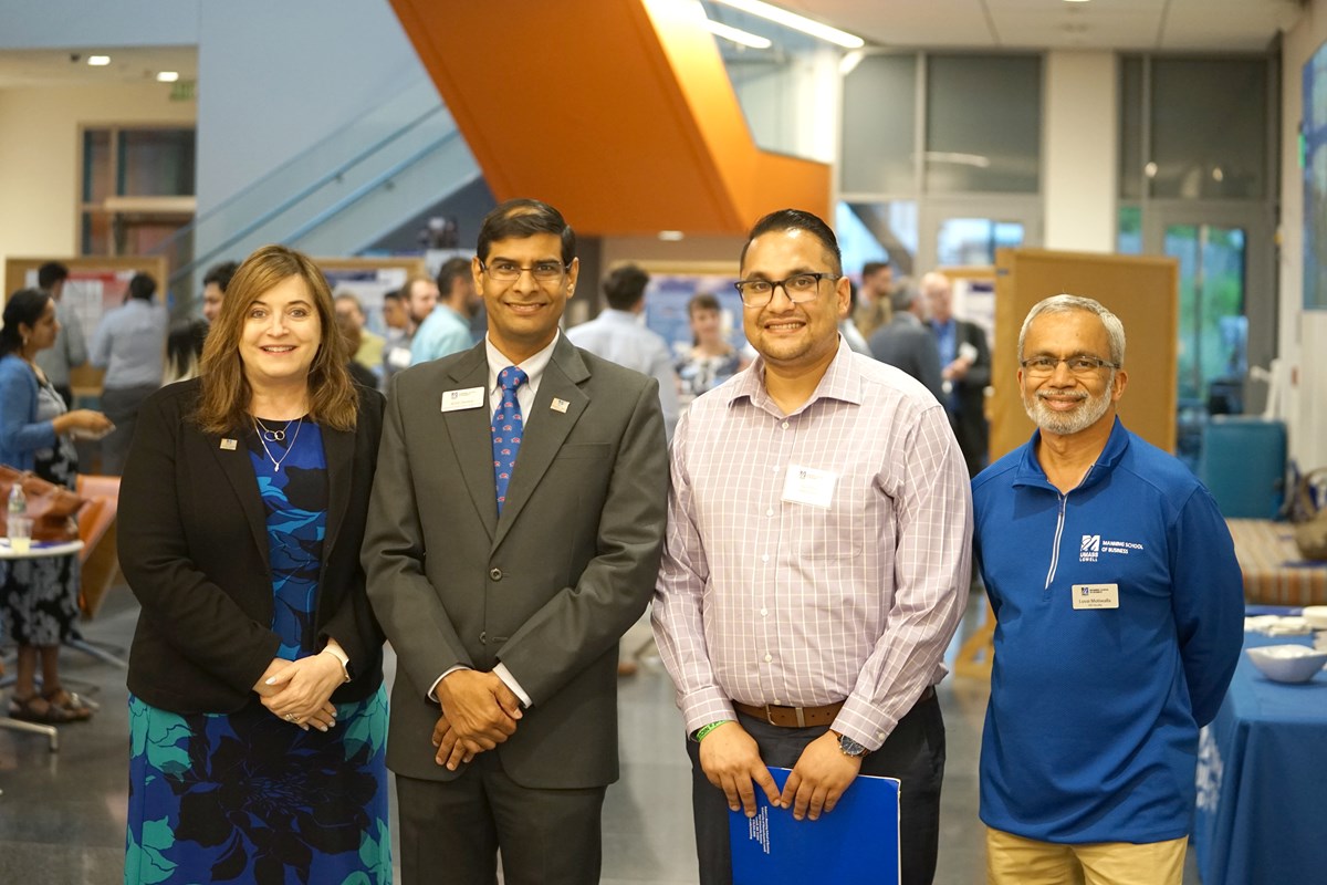 MSBA alum Varun Bisht '21, second from right, caught up with, from left, Manning School Dean Sandra Richtermeyer, Assoc. Prof. Amit Deokar and Program Coordinator Luvai Motiwalla during the capstone presentations earlier this summer at the Pulichino Tong Business Center.