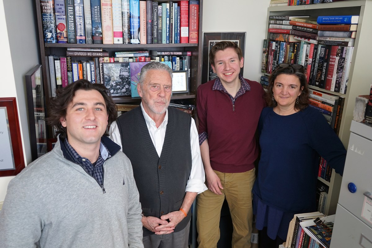 A good chunk of the labor behind the Library of New England Immigration includes (from left) alum Ernest Guerrera '18, History Professor Robert Forrant, junior Cameron Blanchard and Ingrid Hess of the Art & Design department. 