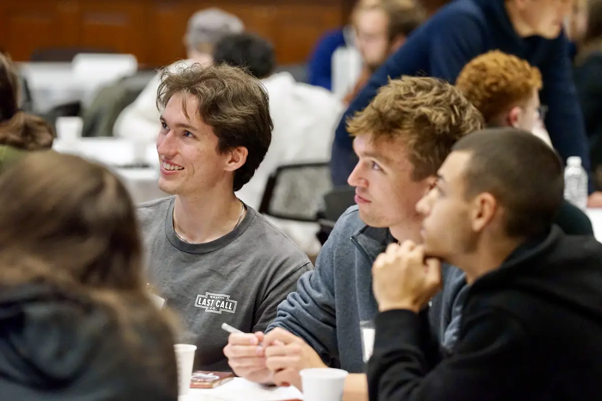 Smiling students in audience at speaker event
