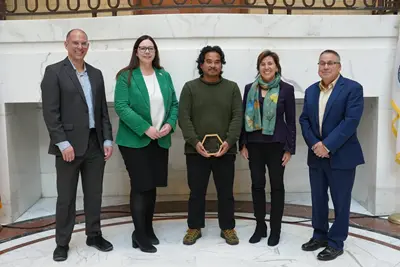 Five people at the Leading by Example awards ceremony.