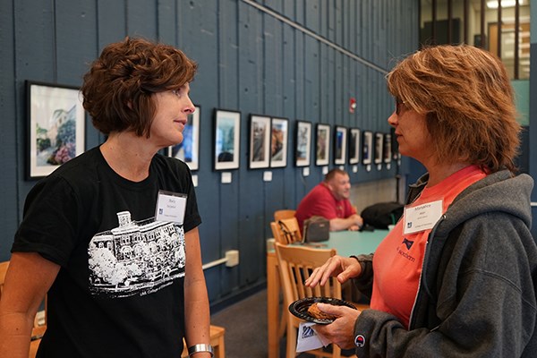 UMass Lowell Assoc. Prof. of Education Stacy Szczesiul chats with Maryalice Aker, a student in the Ed.D. Leadership in Schooling online program