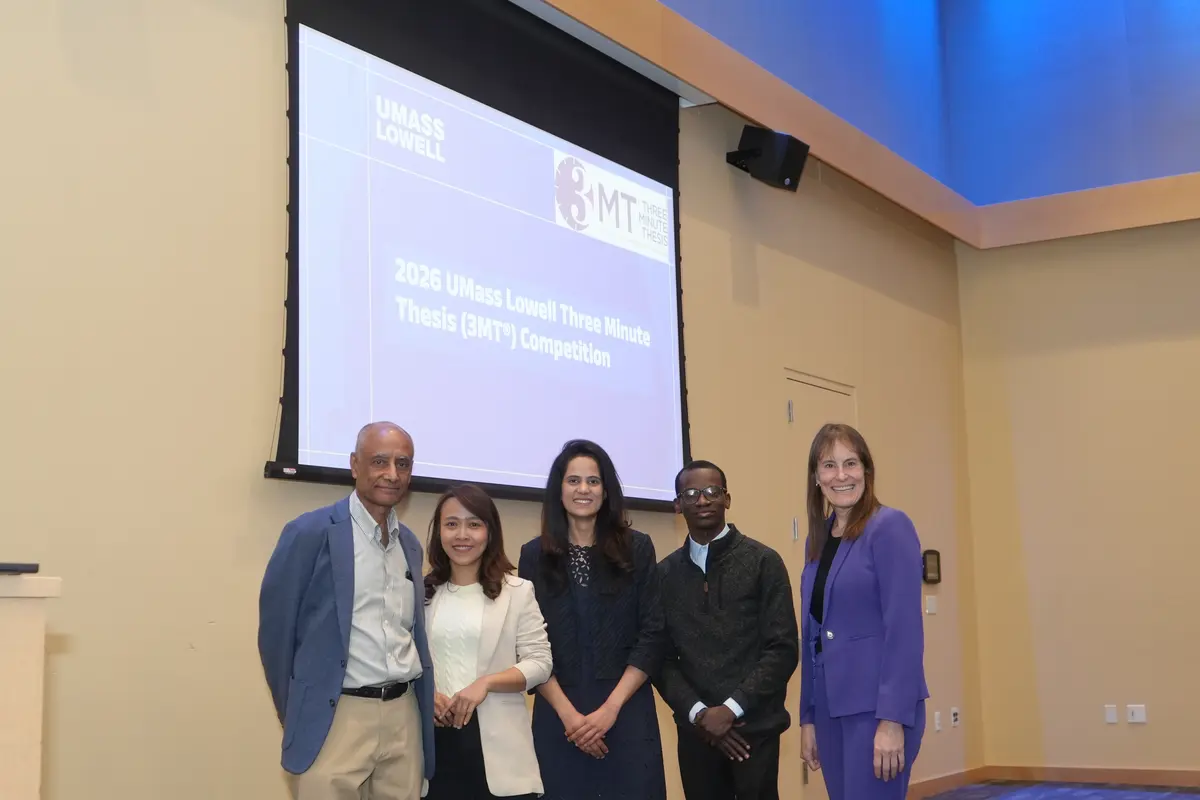 2026 3 Minute Thesis winners stand with the Head and Associate Head of the Graduate School.