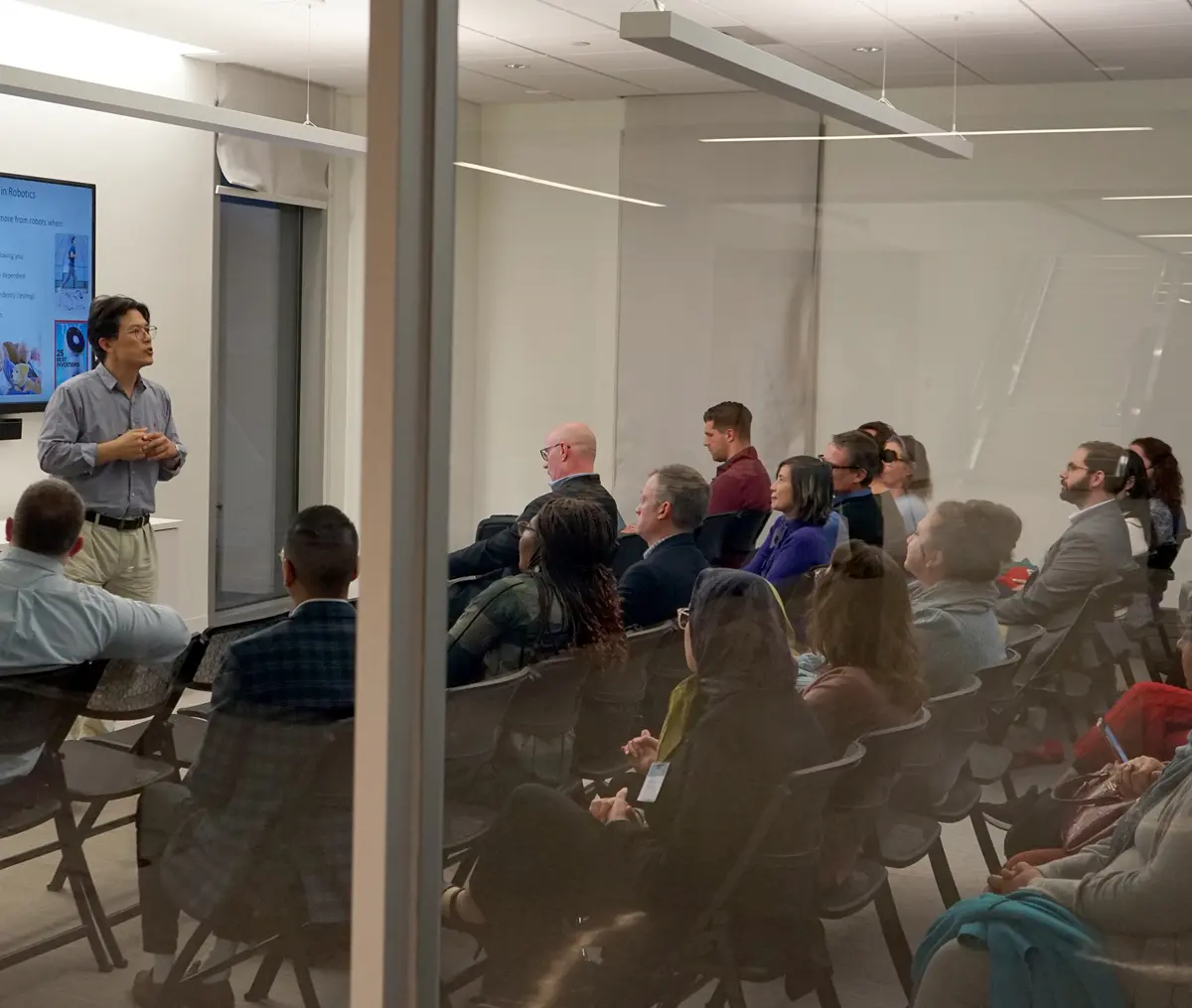 Faculty member presenting to an audience.