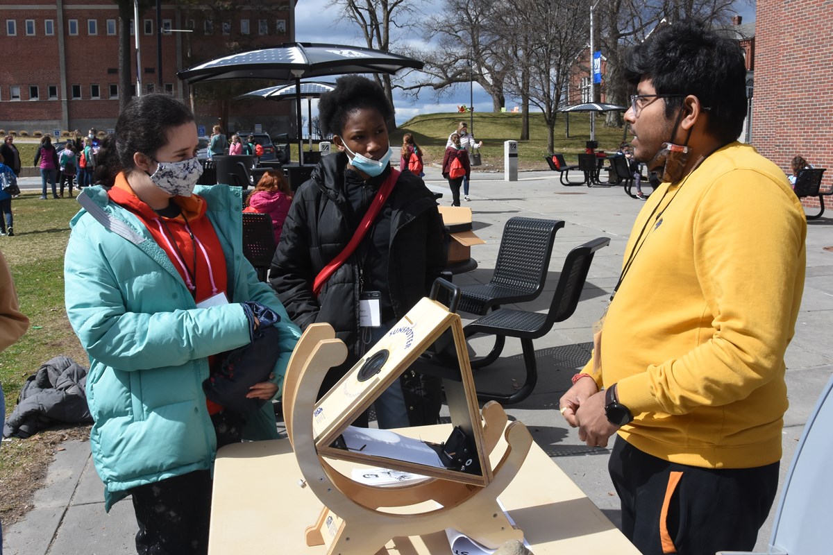 Grad student Ankur Roy explaining the Sunspotter to the visitors