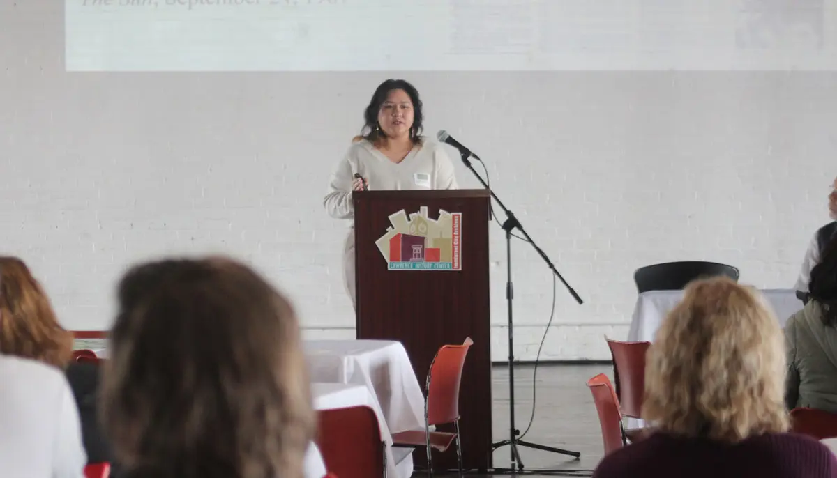 Daranee Khoeun speaks at a lectern.