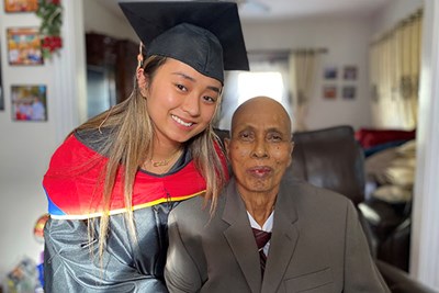 UML nursing student Darany Long with her grandfather, Saran Yous