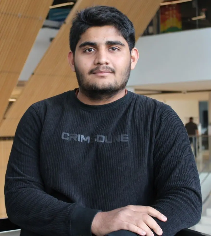 Devansh Ramani wearing a Crimsoune shirt.