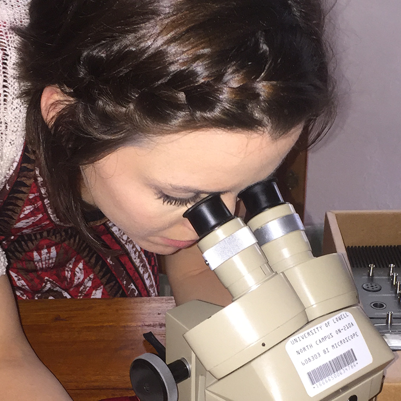 Girl looking into microscope