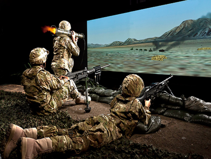 Soldiers shooting electronic weapons at a screen
