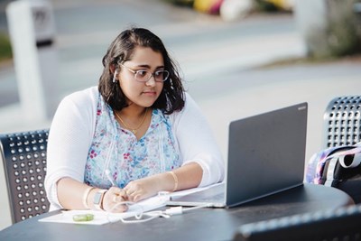 A student works with her laptop