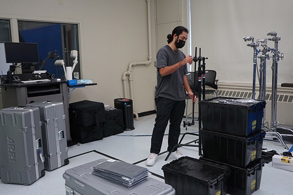 UML senior Lucas Bermudez checks out the new equipment in the digital media studio