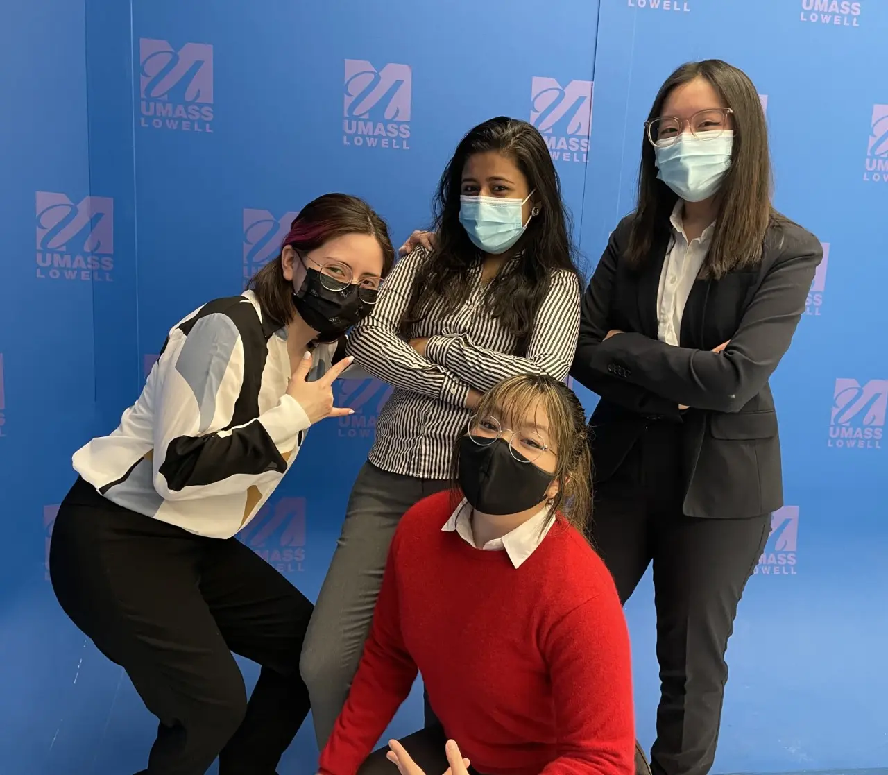 Smriti Kumar, Alejandro Luna Juarez, Tina Thuy Nguyen Hoana, and Amy Nguyen smiling for a group photo.