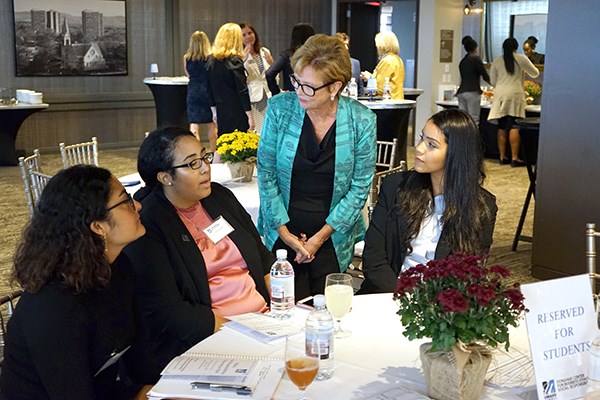 Chancellor Jacquie Moloney greets students at the UMass Club