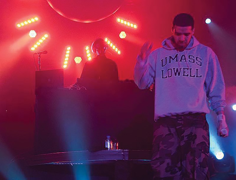 Drake wearing a UMass Lowell sweatshirt