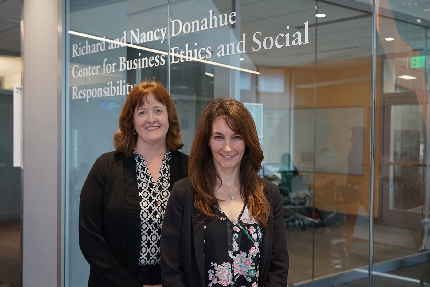 Elaine Magnant and Erica Steckler in front of the Donahue Center for Business Ethics