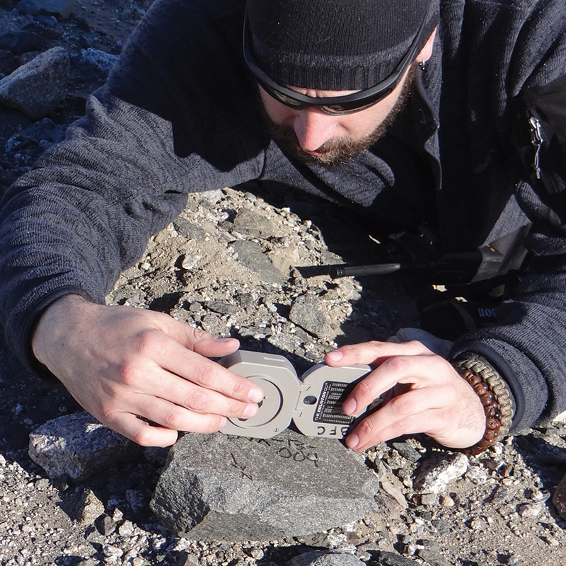 Man working with rocks in Antarctica