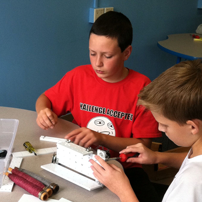 Two boys building at table at Tsongas Industrial History Center