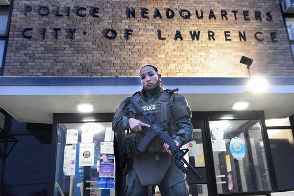 Jessica Botero in front of the Lawrence Police HQ