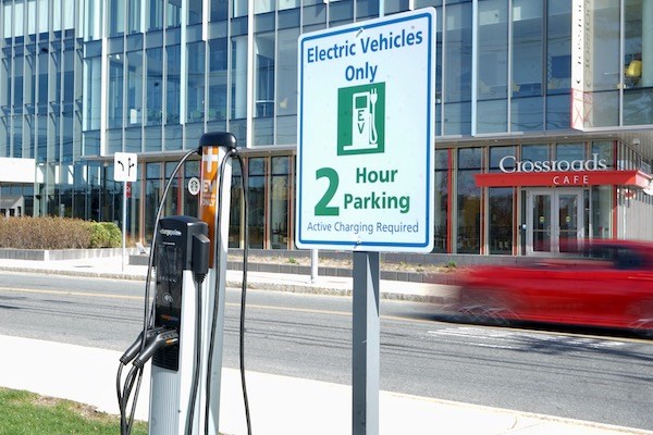 An electric vehicle charging station at University Crossing