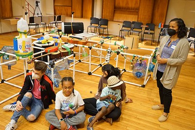 Psychology Assoc. Prof. Rocio Rosales observes at the Ecosonic Playground camp for children with autism