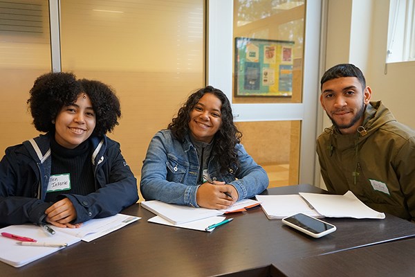 Lawrence High School students Ellen Infante, Yanelyse Lopez and Oscar Burgos attended a teaching methods class at UMass Lowell