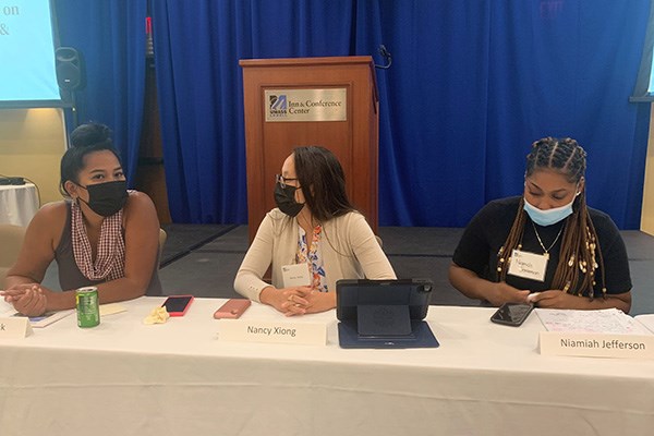 ARISE Executive Director Chanda Womack and Lead Organizers Nancy Xiong and Niamiah Jefferson at the UML Panasuk Symposium on critical race theory