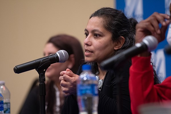 Radha Natarajan, executive director of the New England Innocence Project, speaks at UMass Lowell with exonoree Sean Ellis