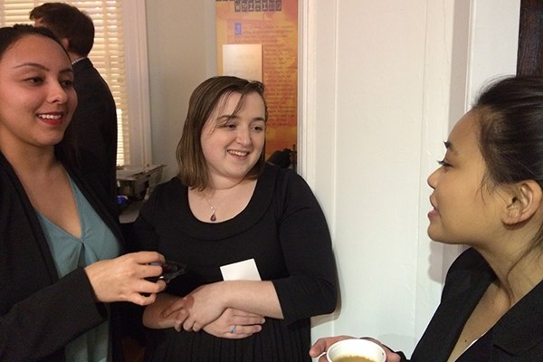 Emily Yunes (center) talks with two other Emerging Scholars at the midwinter presentation.