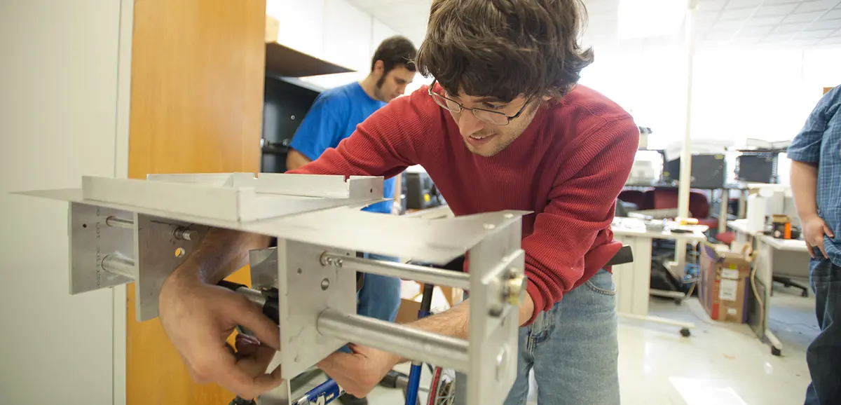 Mechanical  Engineering male student working with equipment