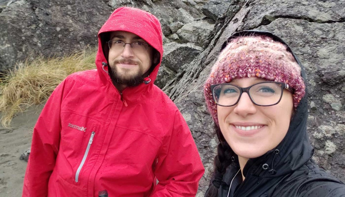 Ericka Boudreau poses with another researcher outdoors in Oregon.