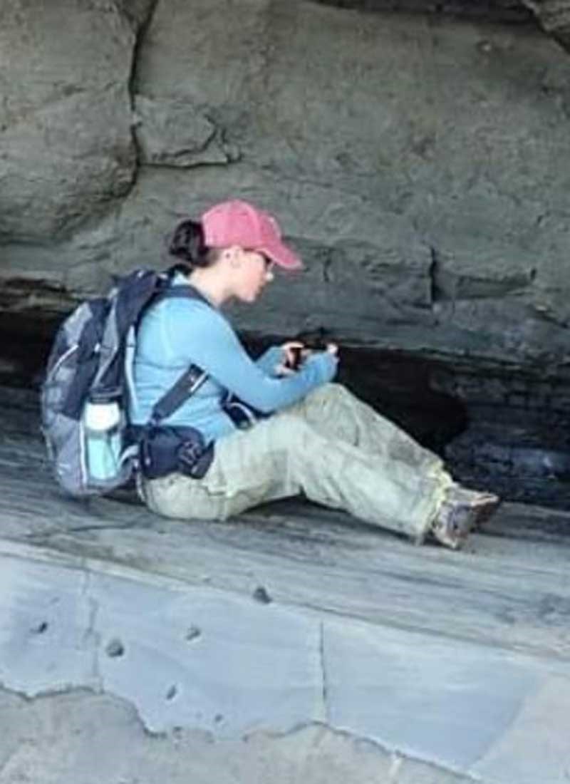 Ericka Boudreau photographing a rock formation